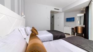 Кровать или кровати в номере Motto Premium Hotel&Spa