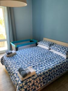 Uma cama ou camas num quarto em Scala Family Home