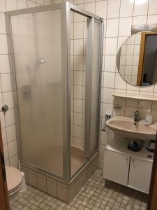 a bathroom with a shower and a sink at Restaurant Engel am Marktplatz Tuttlingen in Tuttlingen