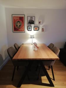 a dining room table with chairs and a lamp at Seepferdchen in Timmendorfer Strand