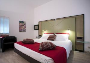Postel nebo postele na pokoji v ubytování Hotel Buonconsiglio