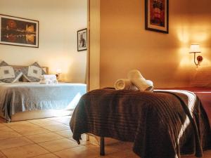 a hotel room with a bedroom with a bed at The Maltese Sun in Sliema