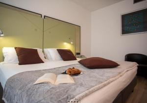 Postel nebo postele na pokoji v ubytování Hotel Buonconsiglio