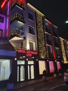 a hotel with christmas lights on the side of a building at Aris Hotel Sofia in Sofia