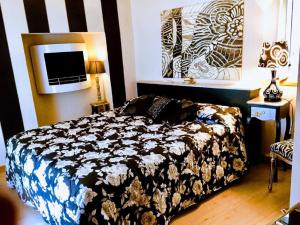 Voodi või voodid majutusasutuse Lori's Inn toas