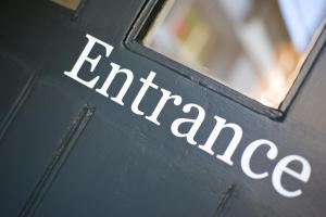a door with the word furniture written on it at 27 The Terrace in St Ives