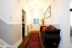 a living room with a couch and a rug at 27 The Terrace in St Ives