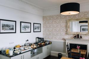 a kitchen with a counter with food on it at 27 The Terrace in St Ives