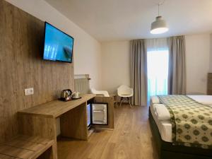 Letto o letti in una camera di Hotel Kronplatzer Hof