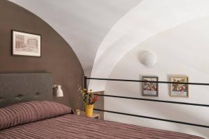 Postel nebo postele na pokoji v ubytování Il Vicoletto Guest House