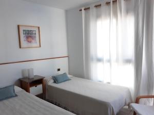 Łóżko lub łóżka w pokoju w obiekcie Villa Suculenta