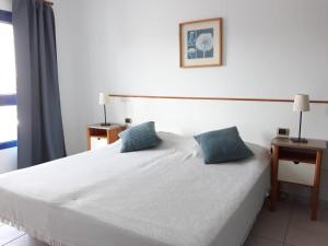 Łóżko lub łóżka w pokoju w obiekcie Villa Suculenta
