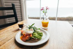 a plate of food on a table with a drink at 27 The Terrace in St Ives