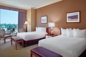 a hotel room with two beds and a television at Harrah's Metropolis Hotel & Casino in Metropolis