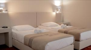 Ліжко або ліжка в номері Zepter Hotel Vrnjacka Banja, member of Zepter Hotels