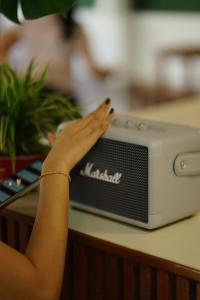 a woman with her hand on a nintendoeper at Barn Laos Hostel in Vientiane