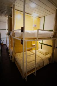 a couple of bunk beds in a room at Barn Laos Hostel in Vientiane
