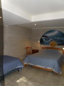Ένα ή περισσότερα κρεβάτια σε δωμάτιο στο Bunya Seaside