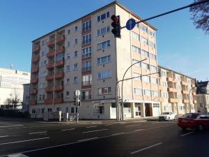 a traffic light in front of a large building at Budget Friendly Private Apartment in Sindelfingen
