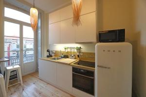 Kuchyň nebo kuchyňský kout v ubytování FLH Porto Trendy Flat