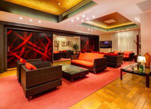 a large living room with couches and a television at Jet Hotel, Sure Hotel Collection by Best Western in Gallarate
