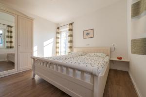 A bed or beds in a room at Mairhof