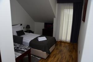 Posteľ alebo postele v izbe v ubytovaní Hotel Meridijan16