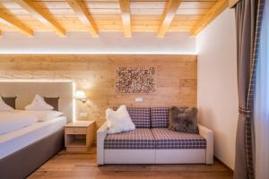 Postel nebo postele na pokoji v ubytování Hotel Ciamp
