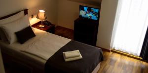 Posteľ alebo postele v izbe v ubytovaní Hotel Meridijan16