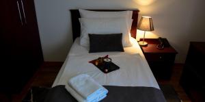 Posteľ alebo postele v izbe v ubytovaní Hotel Meridijan16