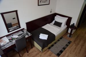 Posteľ alebo postele v izbe v ubytovaní Hotel Meridijan16