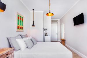 TV i/ili multimedijalni sistem u objektu Hesperides Hotel Pefkochori