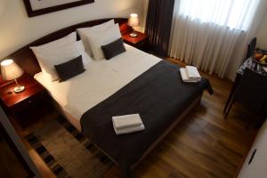 Posteľ alebo postele v izbe v ubytovaní Hotel Meridijan16