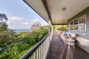 a balcony with a view of the ocean at 12 Merinda Crescent in Point Lookout