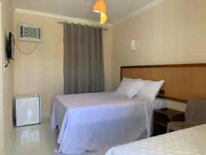 Postel nebo postele na pokoji v ubytování Pousada Aruana Praia + 15 fotografií