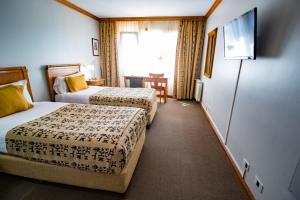 Uma cama ou camas num quarto em Hotel Kosten Aike