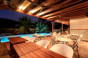 a patio with tables and chairs and a pool at Eurostars Marqués de Villalta in Cartagena de Indias