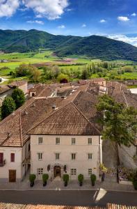 a small town with a large building on top of it at Relais & Chateaux Palazzo Seneca in Norcia