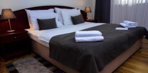 Posteľ alebo postele v izbe v ubytovaní Hotel Meridijan16
