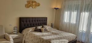 a bedroom with a bed with a black headboard at Your Way in Venice in Mestre +57 photos
