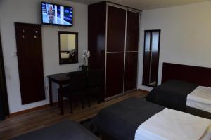 Posteľ alebo postele v izbe v ubytovaní Hotel Meridijan16