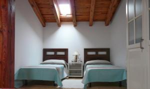 Postel nebo postele na pokoji v ubytování Casa Las Viñas