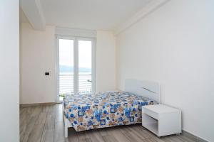 Postel nebo postele na pokoji v ubytování Appartamento Fronte Mare
