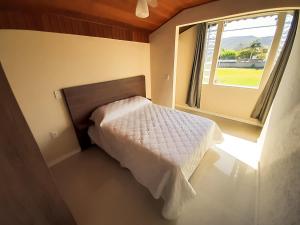 Giường trong phòng chung tại Pousada Recanto Estaleiro Residencial