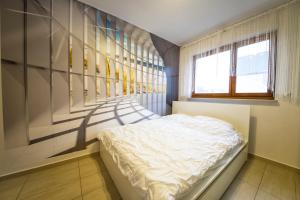 En eller flere senge i et værelse på Wyspa Uznam - Platan