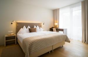 Łóżko lub łóżka w pokoju w obiekcie Hotel Post Wrann