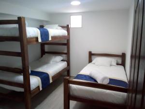 Postel nebo postele na pokoji v ubytování Hotel Palmi