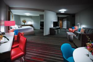
a living room filled with furniture and a couch at Universal's Hard Rock Hotel® in Orlando
