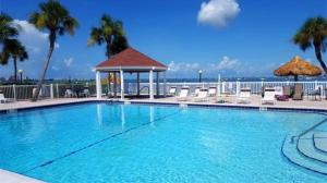 a large swimming pool with a gazebo at TWO Bedroom TWO Bath Family Condo - Sleeps Four - Unit B - Private Beach in St. Petersburg