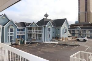 a view of a building with a parking lot at Falls Lodge & Suites in Niagara Falls